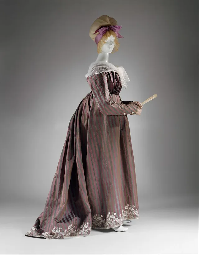 Regency era fashion: a white round gown of about 1795 with the new high waist